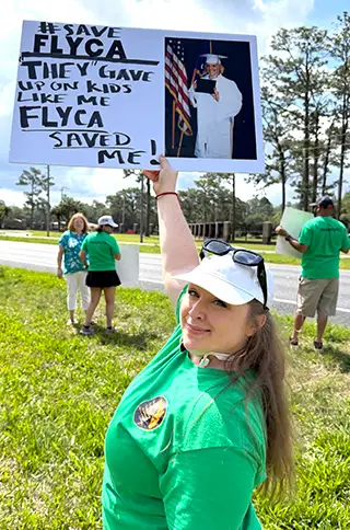 Alumni rally in support of FLYCA