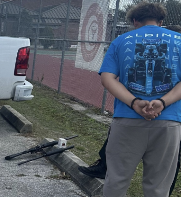 2 arrested for having shotgun at high school