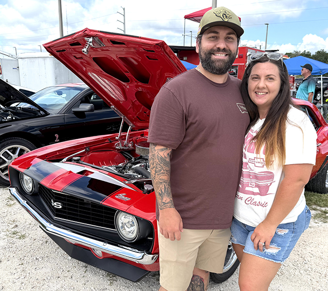 Titan Chevrolet hosts car show, gives away backpacks for students